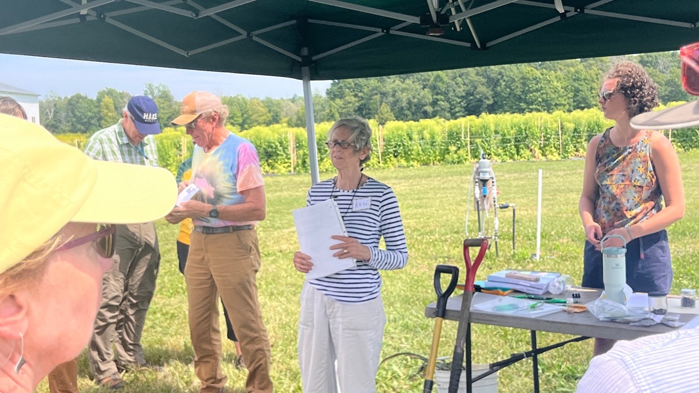 Dr. Hazelrigg addressing a small group of people